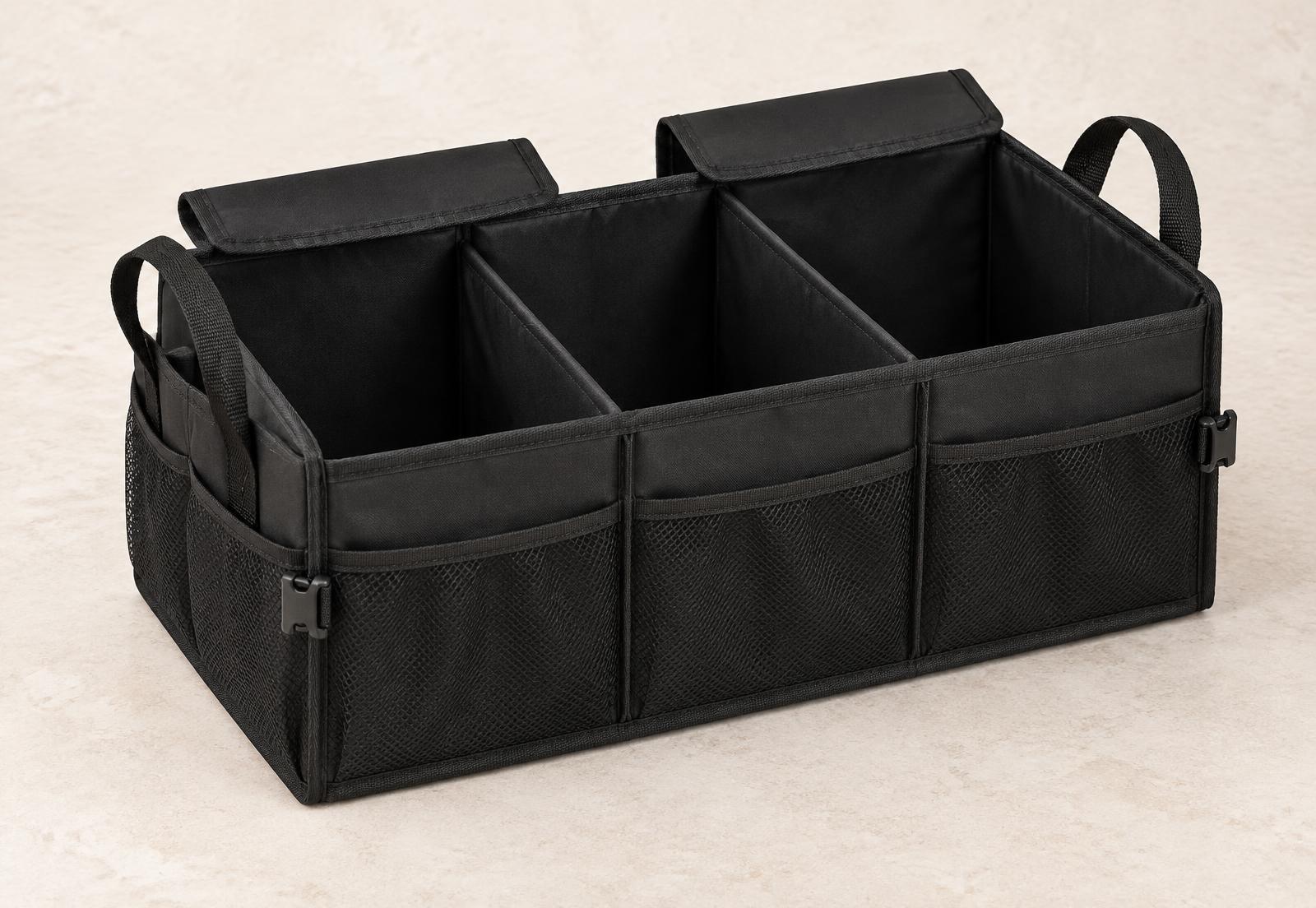 The open STOWVELA. Trunk Organizer showing three compartments, two Velcro lids, mesh pockets and two handles